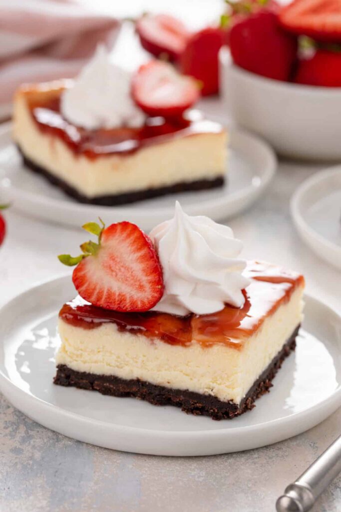 close up strawberry cheesecake bars
